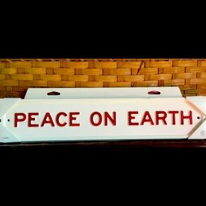 Metal “Peace On Earth” sign by Magnolia
